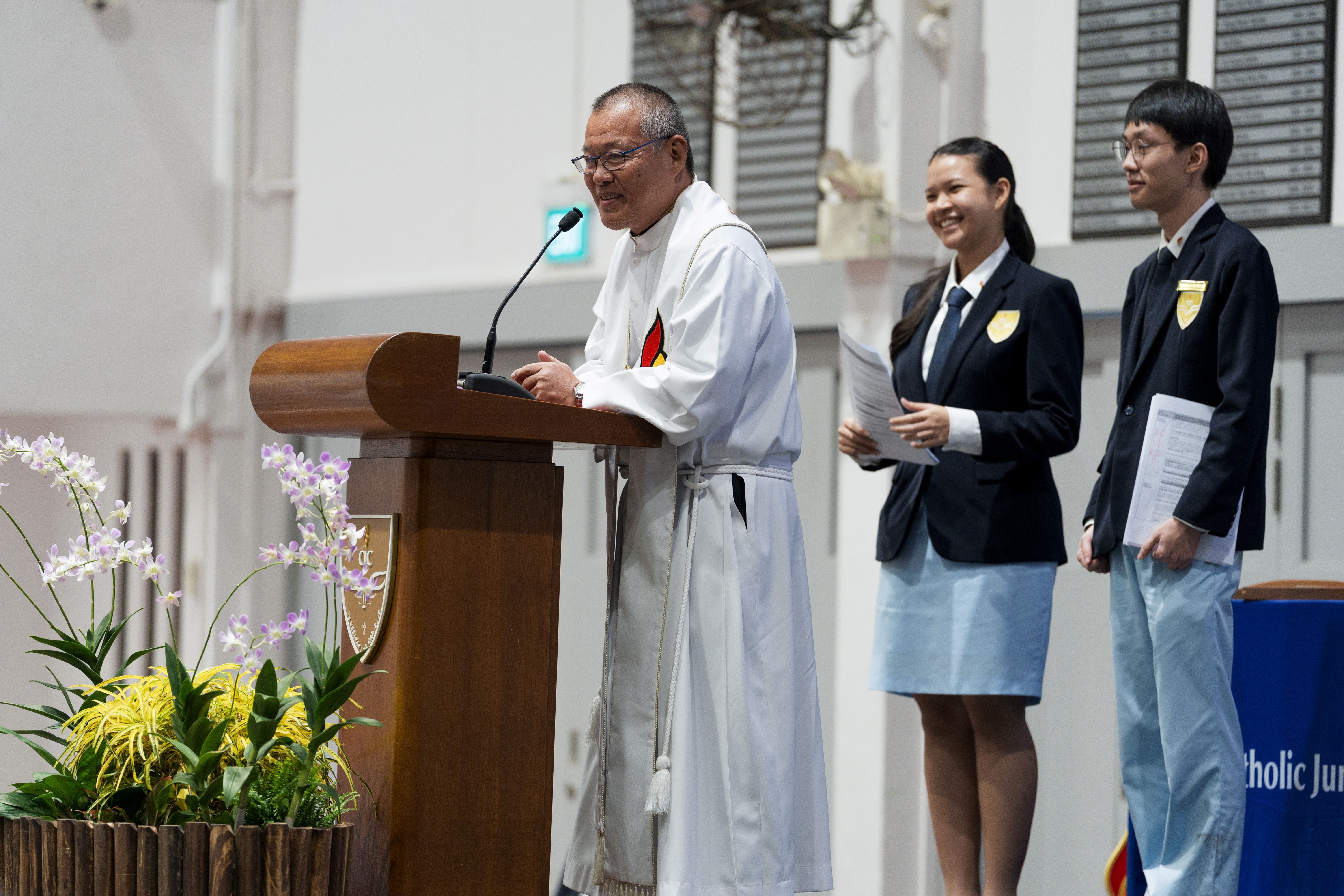 College Chaplain and student emcees at 51st College Day